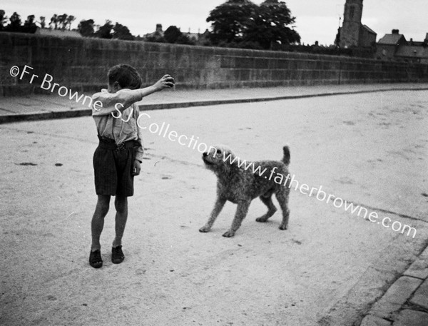 BOY WITH DOG